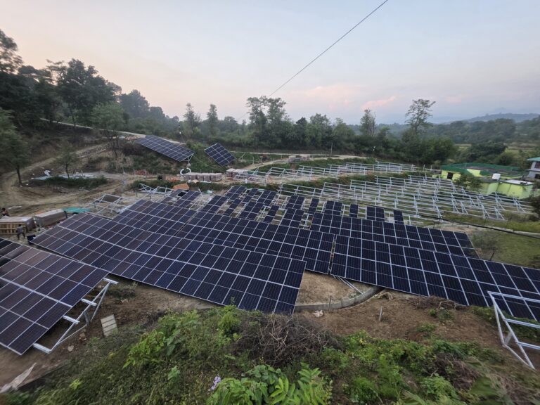 Ground-mounted solar panels installed alongside mounting structures.